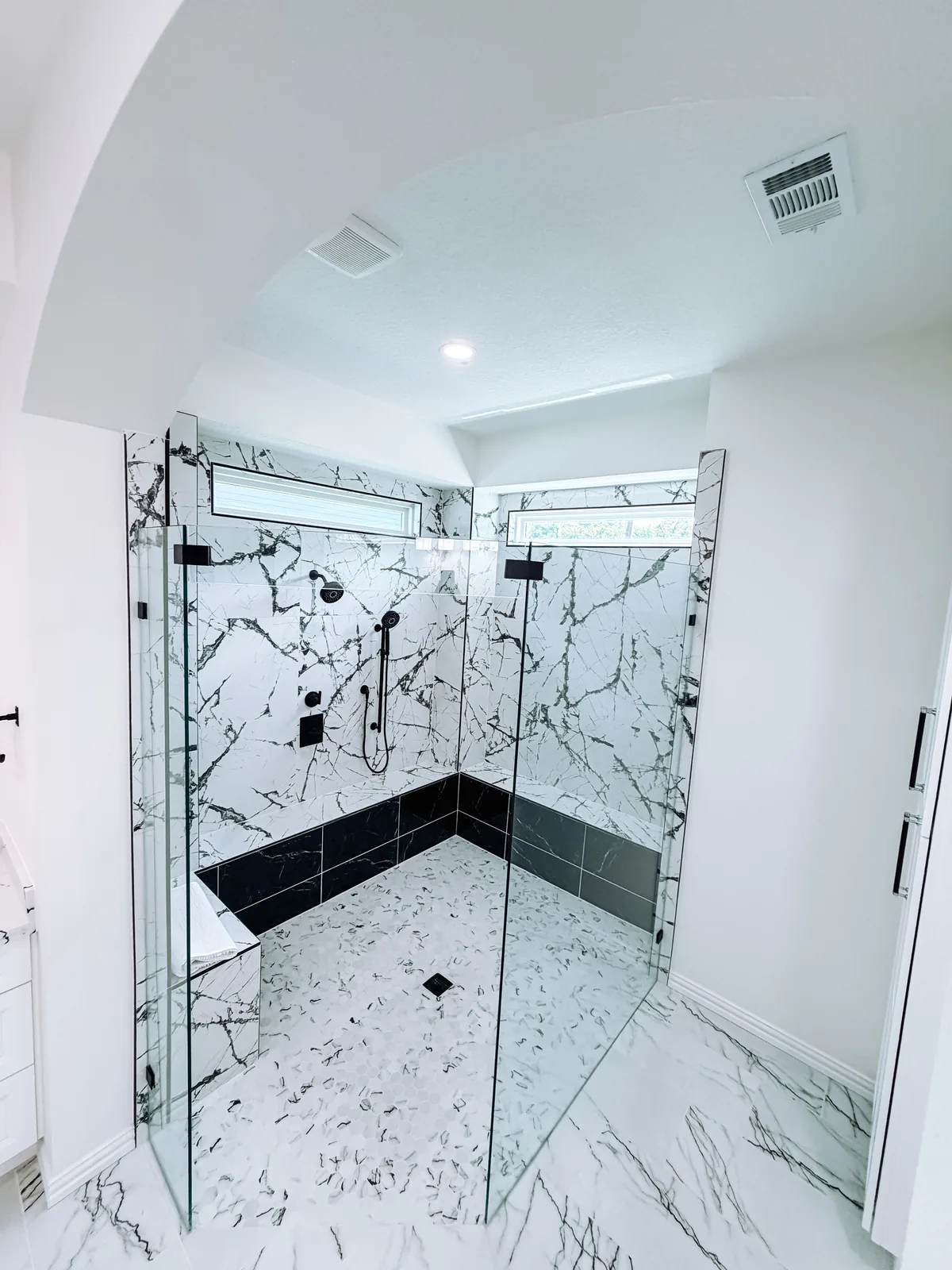 Spa-like remodeled bathroom with freestanding tub by Texan Home Additions in League City, TX