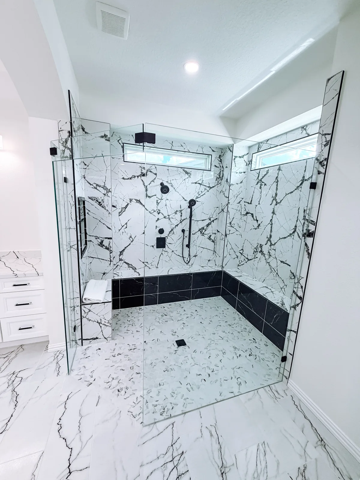Custom walk-in tile shower in a remodeled Pearland, TX bathroom by Texan Home Additions