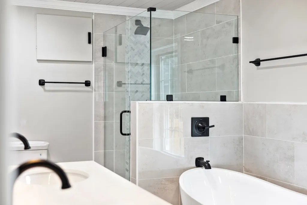 Renovated bathroom with walk-in tile shower