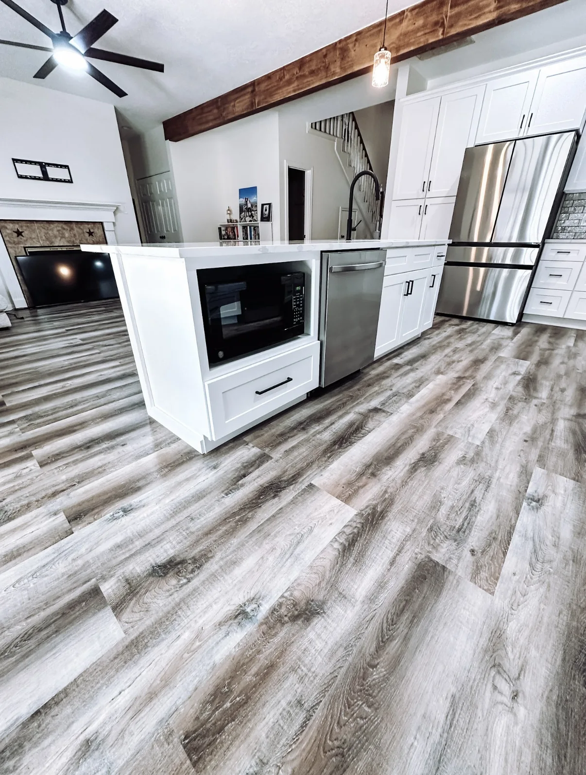Bright white kitchen remodel with quartz island in Manvel, TX
