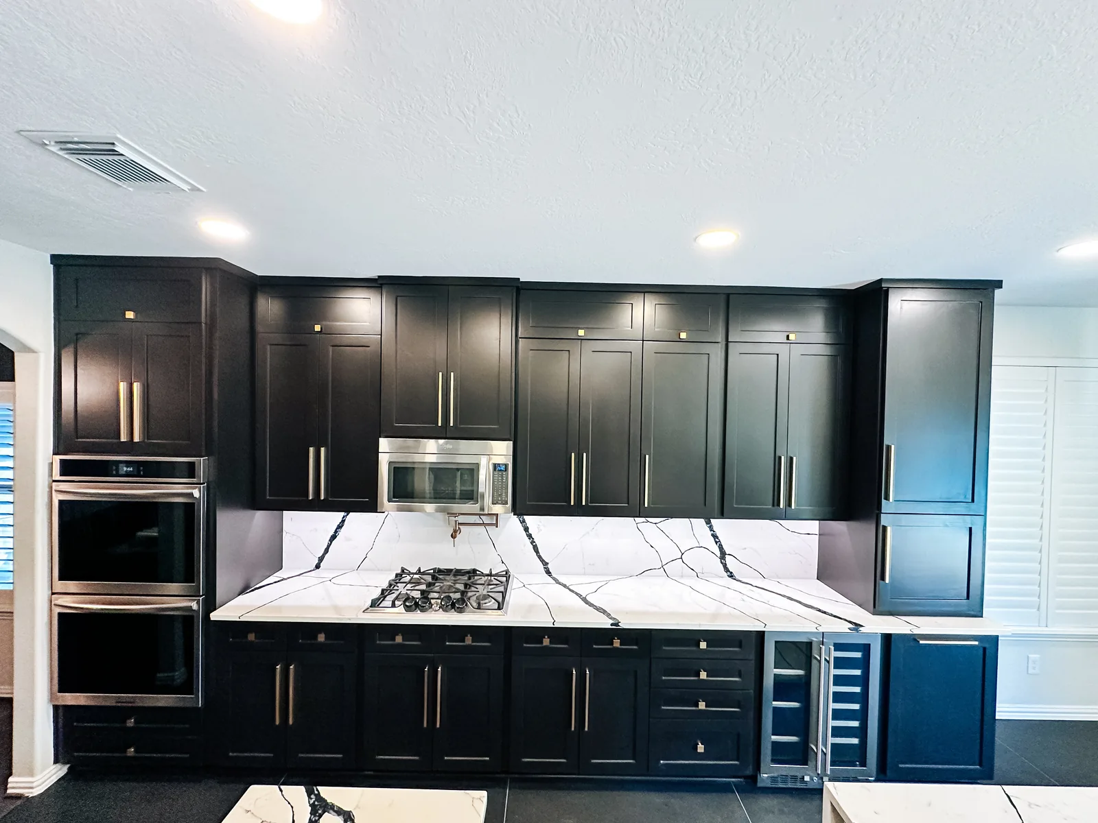 Spacious remodeled kitchen with custom cabinets and island in Manvel, TX by Texan Home Additions