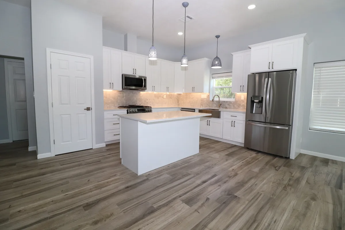 New home addition finished as a bright kitchen space with an island in Pearland, TX