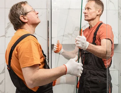Workers installing a shower
