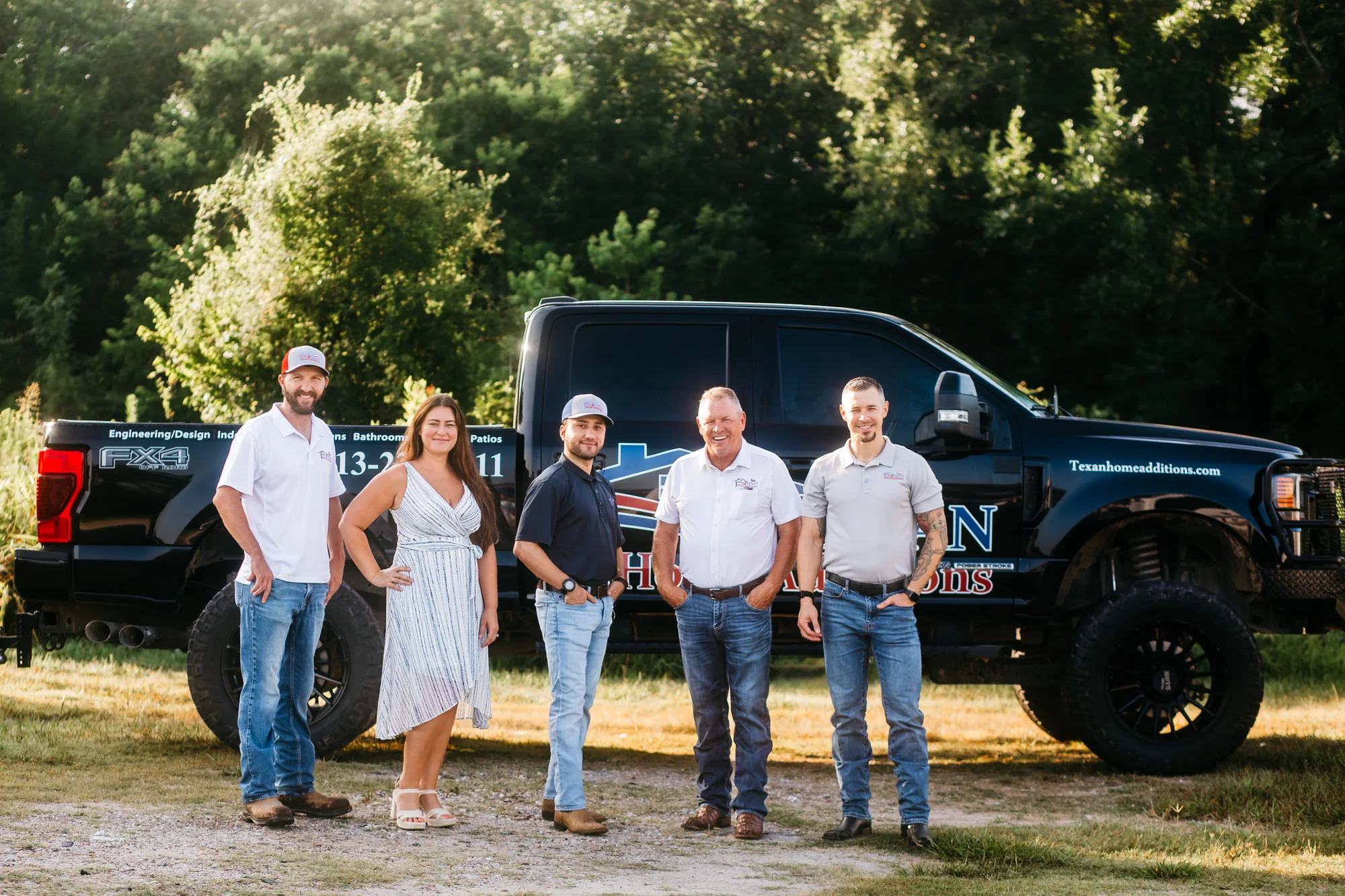 The family-owned Texan Home Additions team outside their company truck in Manvel, TX